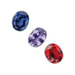 blue, red and purple spinel gemstones on a white background