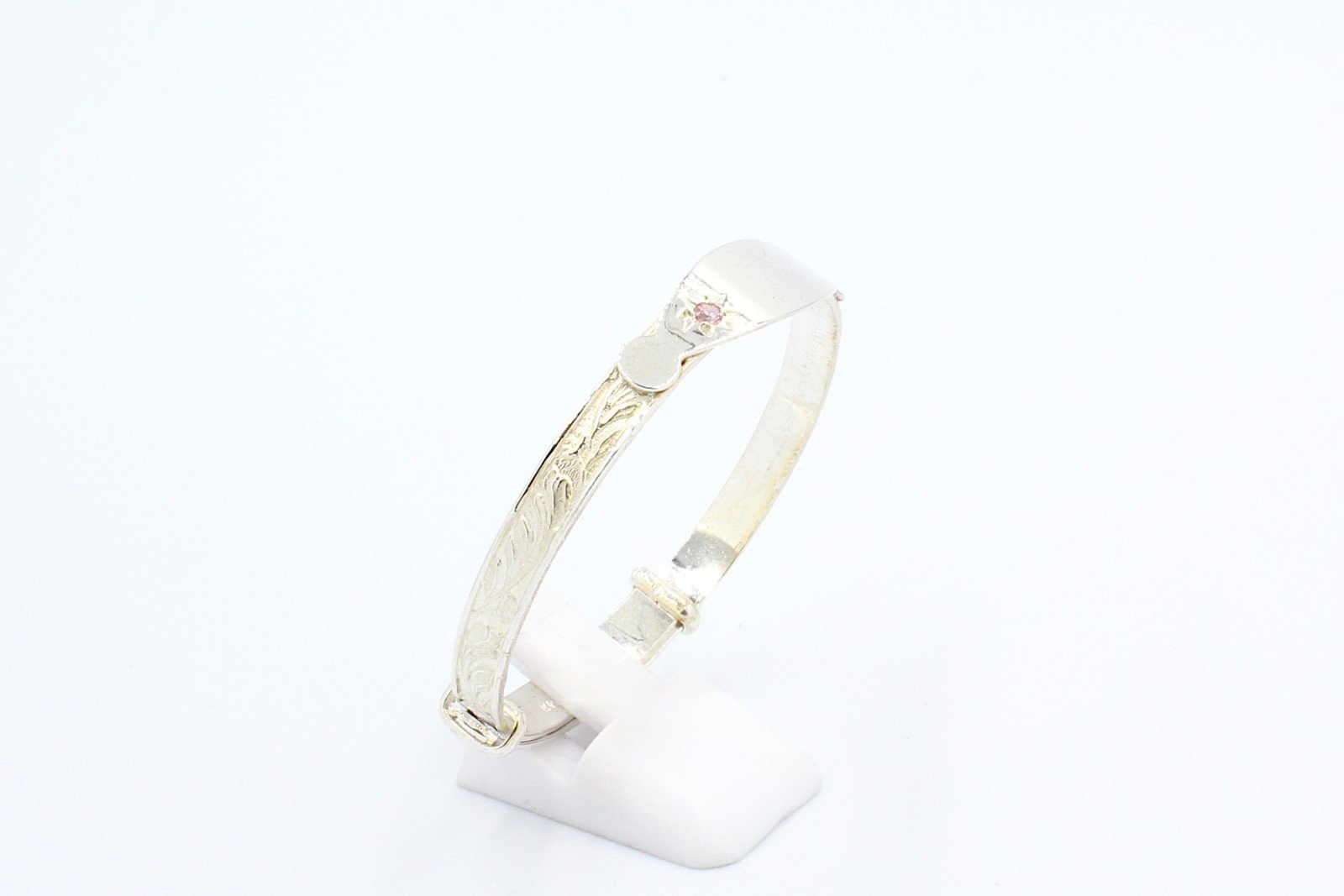 a torx baby bangle engraved with patterns