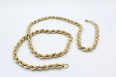 a gold rope chain on a white background