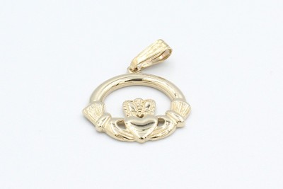 a gold claddagh pendant on a white background