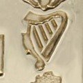 a gold irish harp symbol
