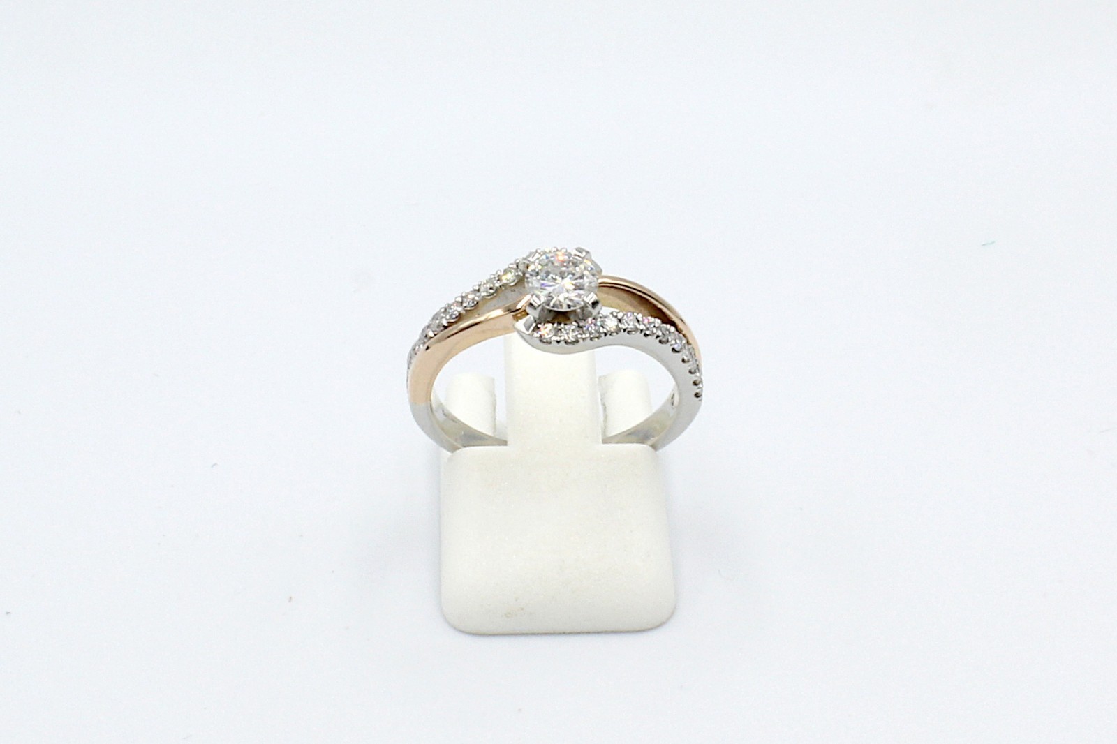 fron tview of a repaired engagement ring on a white background
