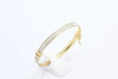 a solid gold and crystal bracelet
