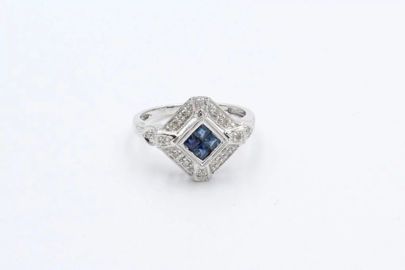front view of a sapphire and diamond art deco style engagement ring