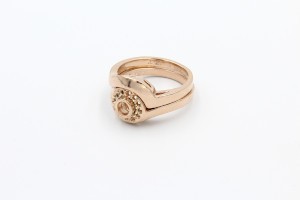 an unfinished rose gold ring without gemstones