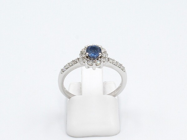 front view of a white gold sapphire and diamond engagement ring
