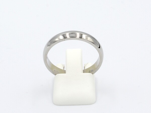 front view of a platinum wedding ring on a white background