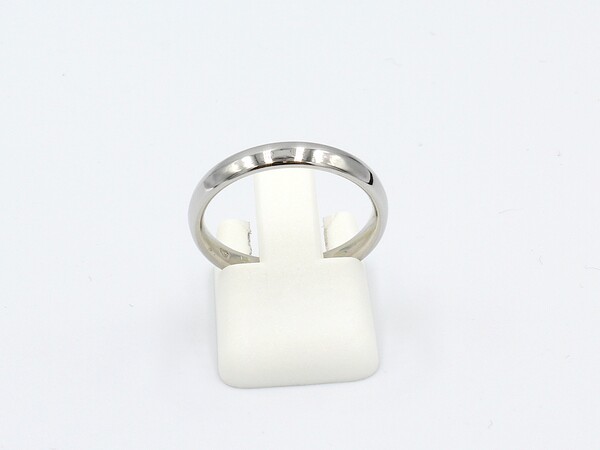 front view of a platinum wedding ring on a white background