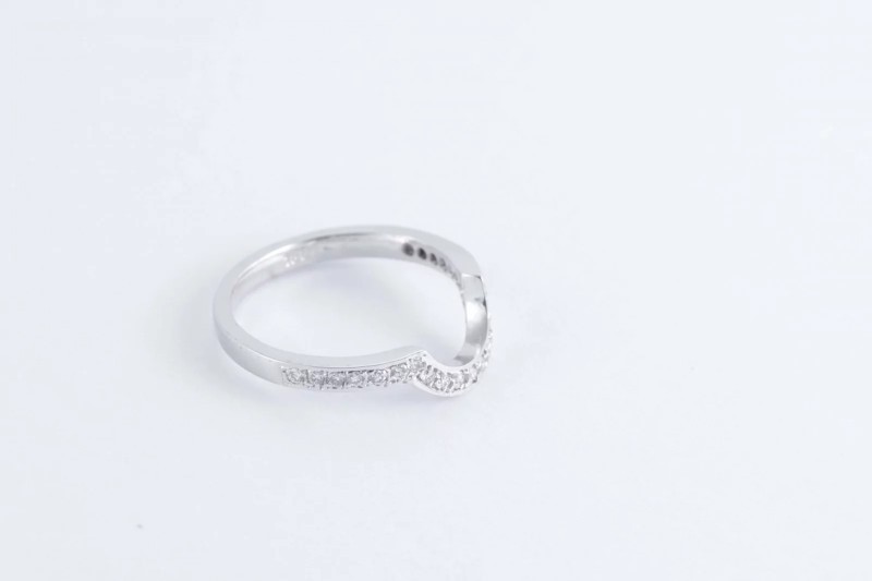 A shaped white gold and diamond wedding ring