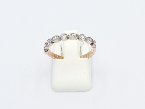 front view of a rose gold vintage style marquee, milgrain ring set with diamonds