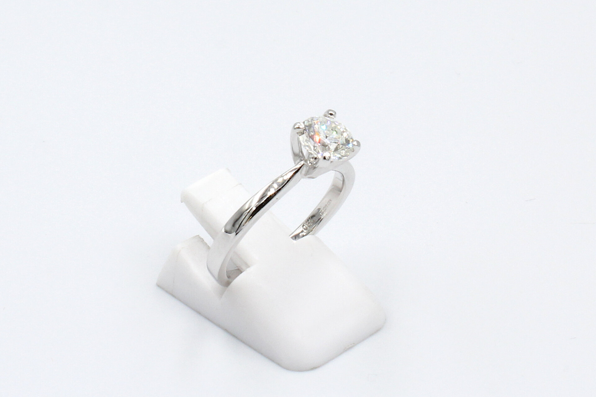 side view of a white gold solitaire diamond engagement ring