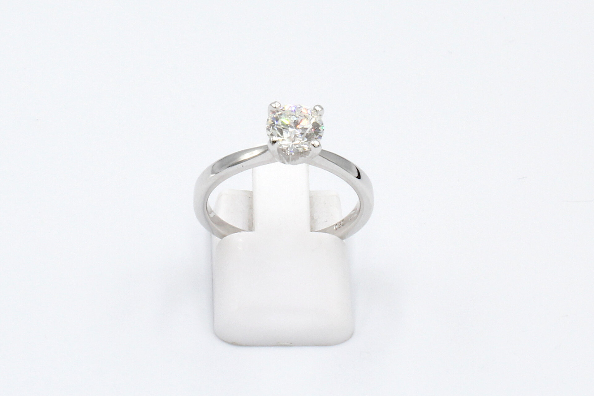 top view of a white gold solitaire diamond engagement ring