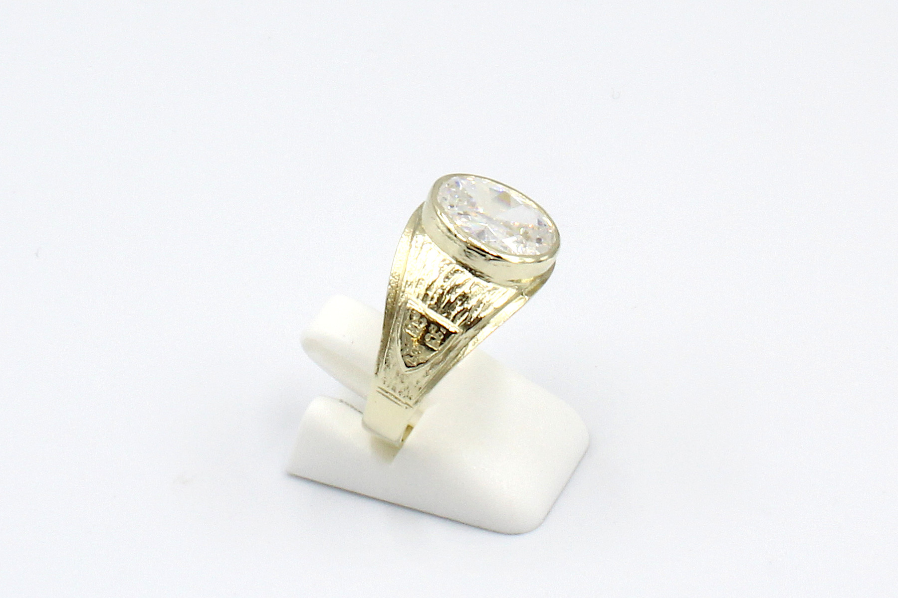 side view of a gold cubic zirconia ring