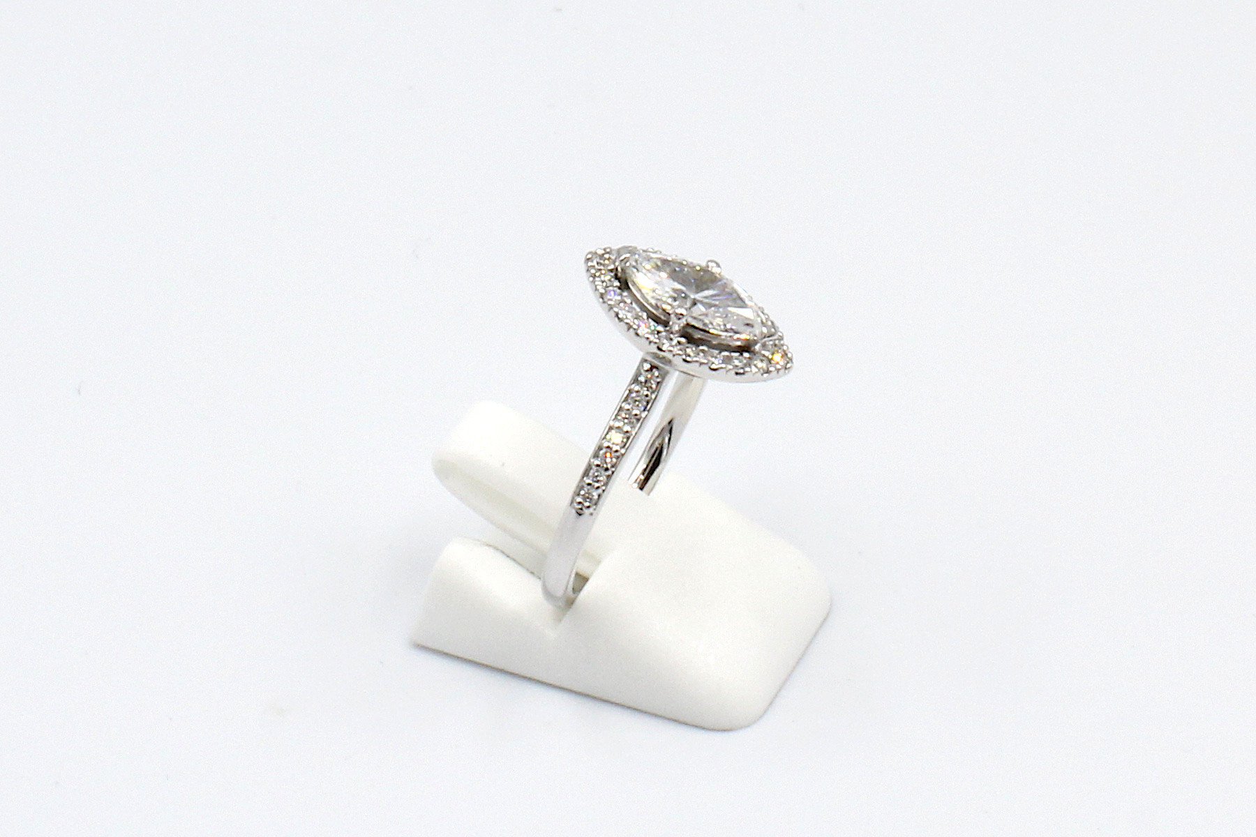 side view of a marquise halo diamond ring