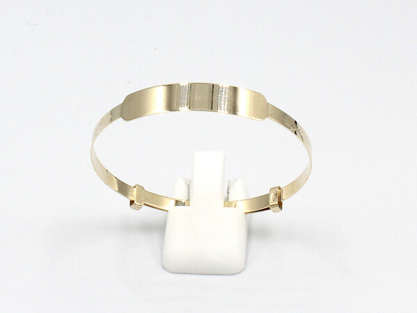front view of a solid gold baby bangle