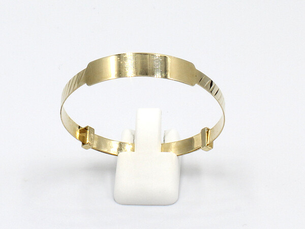 front view of a solid gold baby bangle