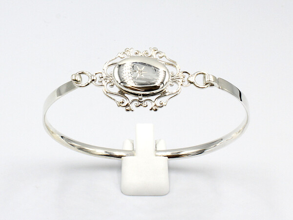 front view of a silver locket bangle