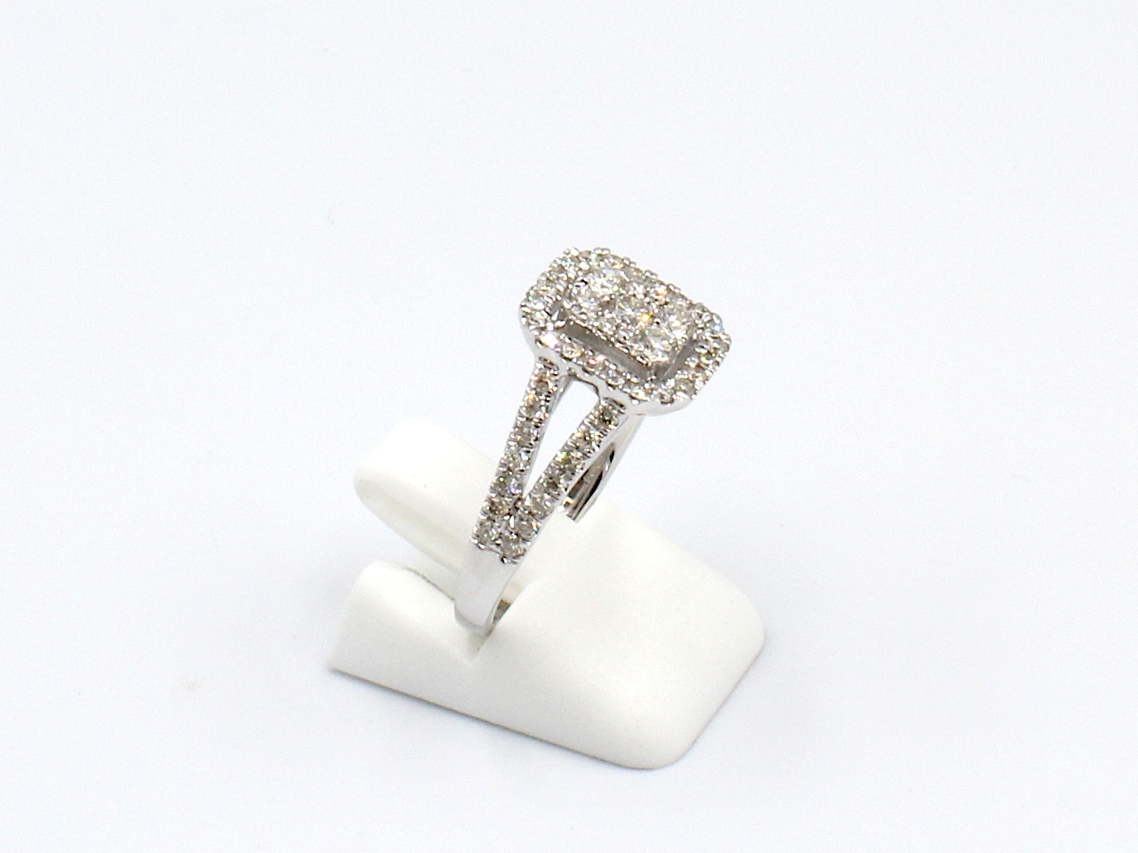 side view of a multi-diamond halo engagement ring