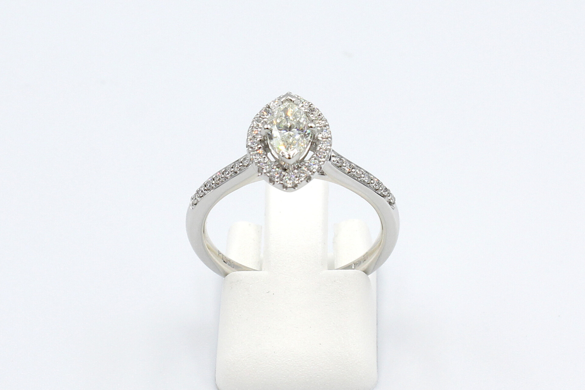 front view of a platinum and diamond halo engagement ring