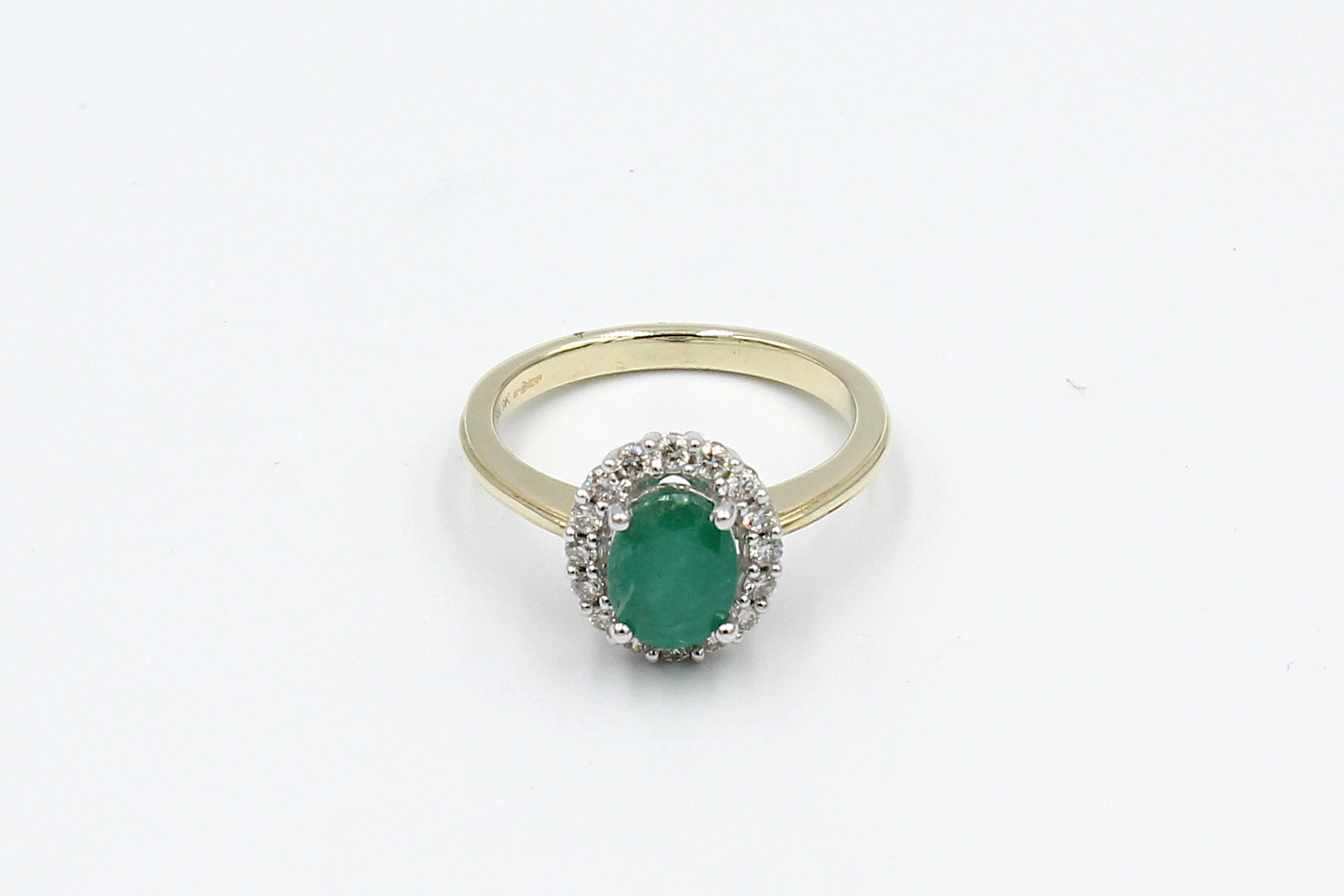 top view gold emerald diamond halo ring