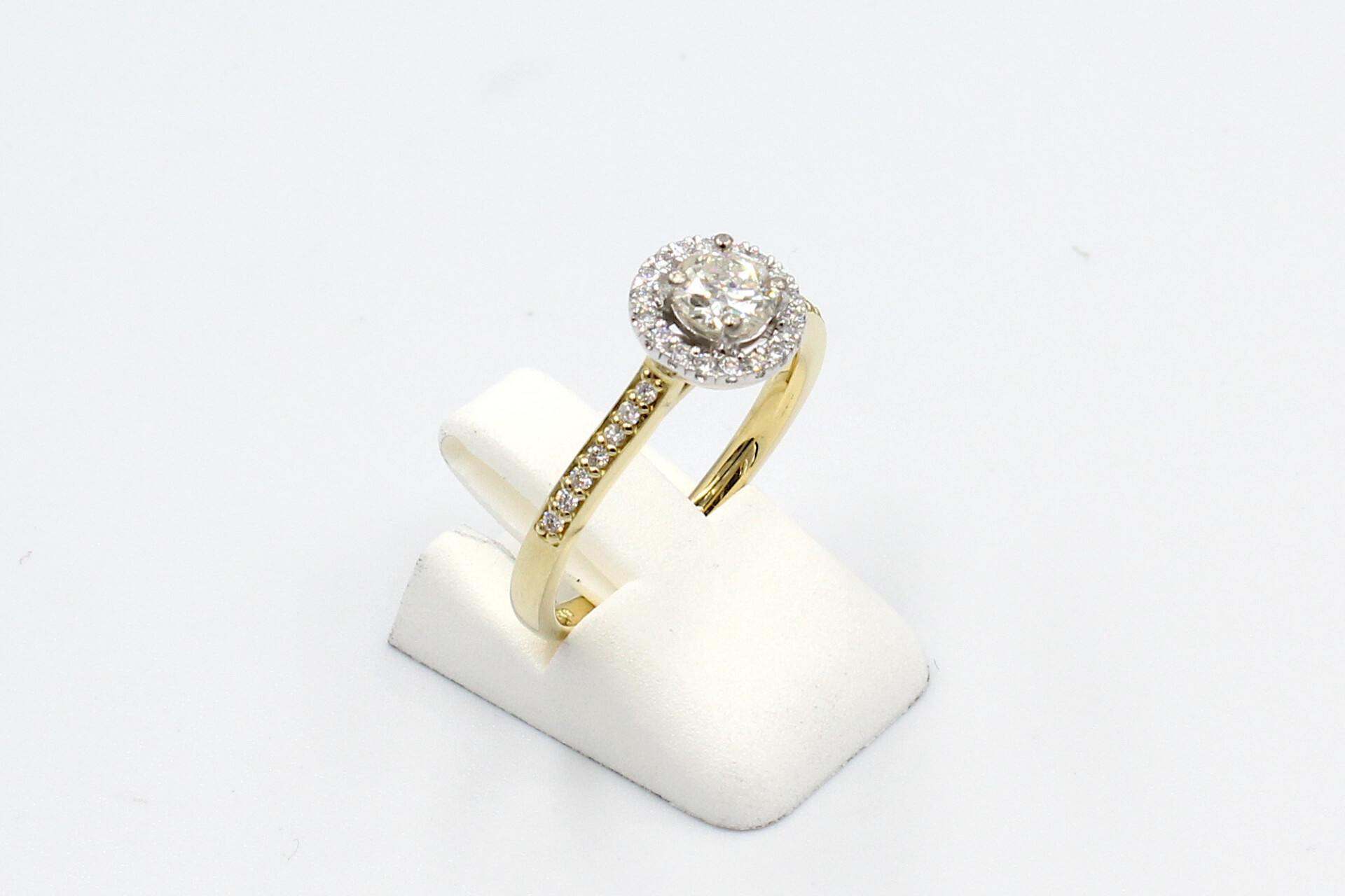 side view gold halo diamond ring
