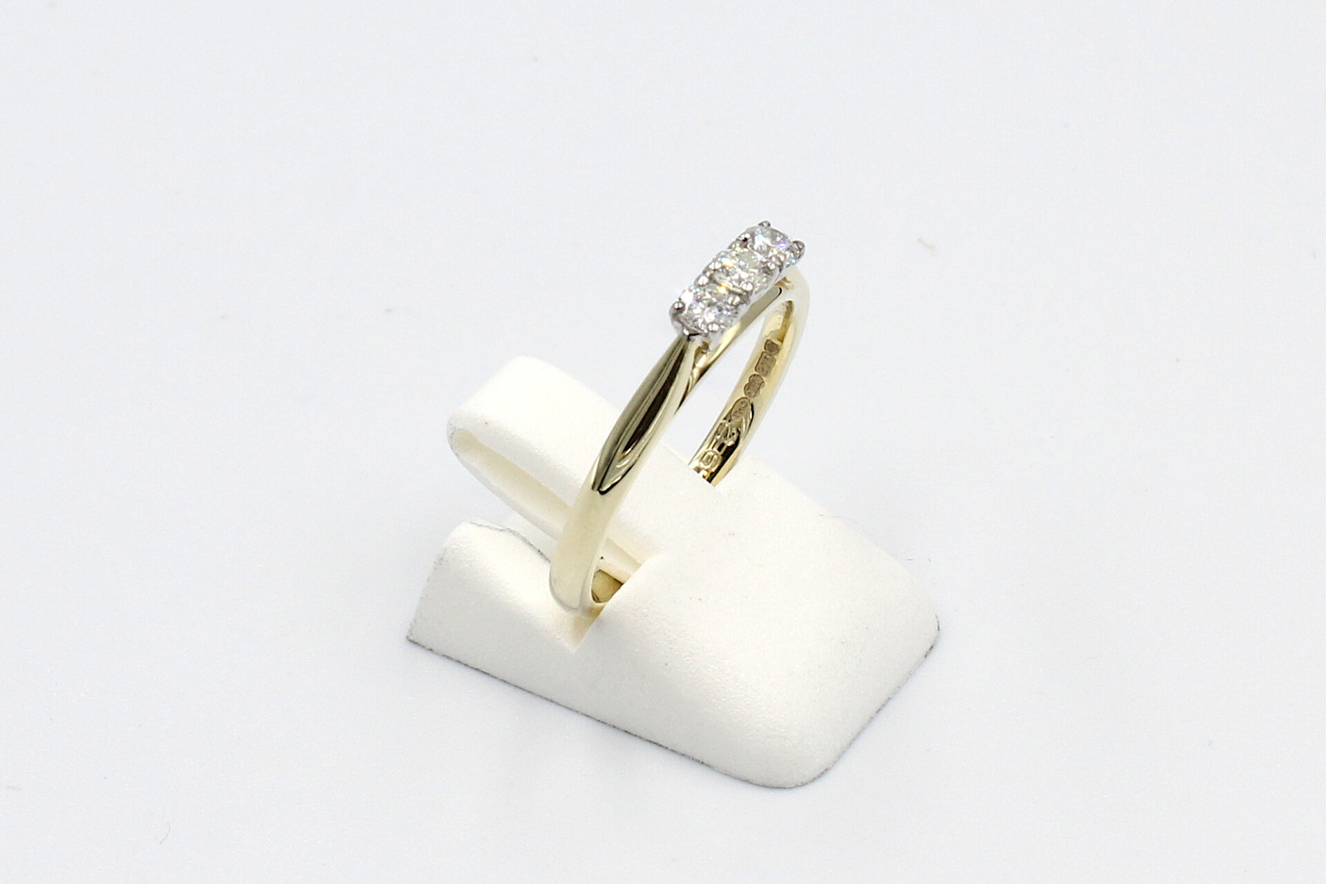 side view gold multi-diamond engagement ring