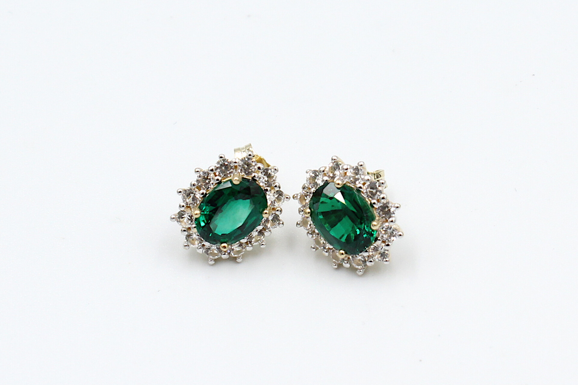 front view faux emerald halo stud earrings