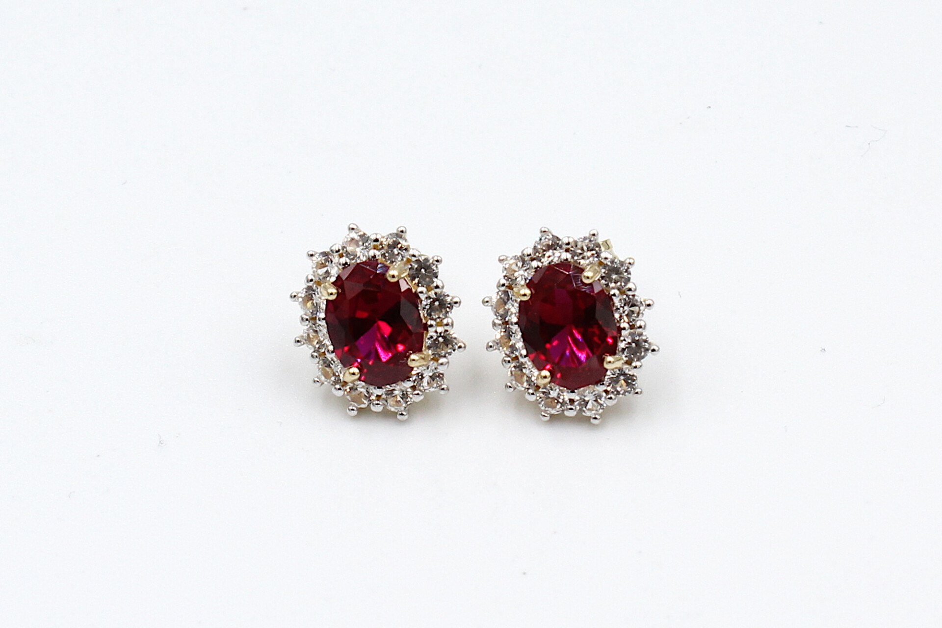front view faux ruby halo stud earrings
