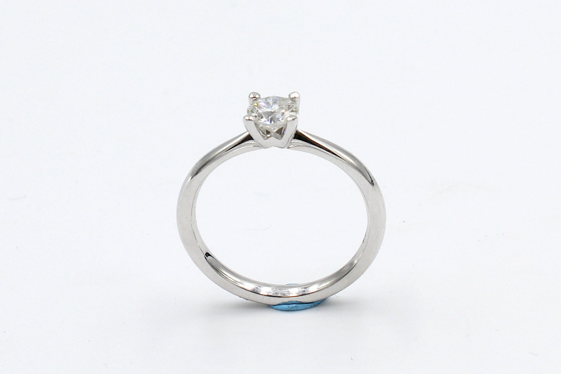 front view of a white gold diamond engagement ring
