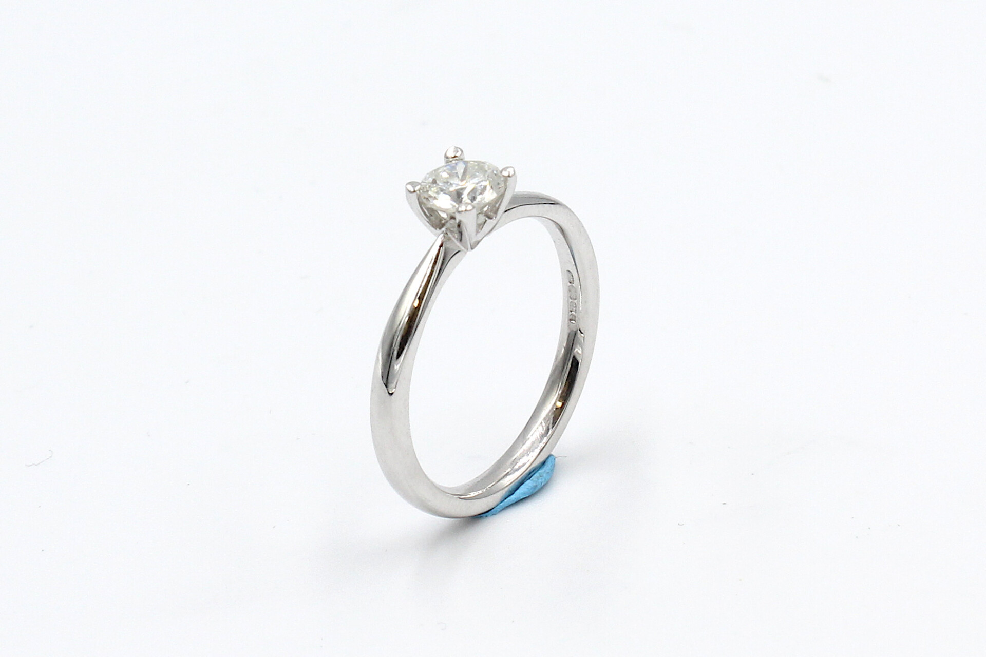 side view of a white gold diamond engagement ring