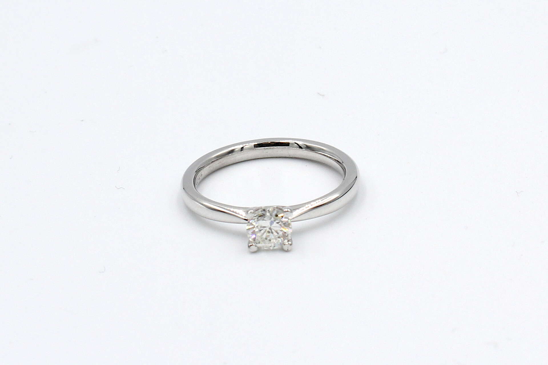 top view of a white gold diamond engagement ring