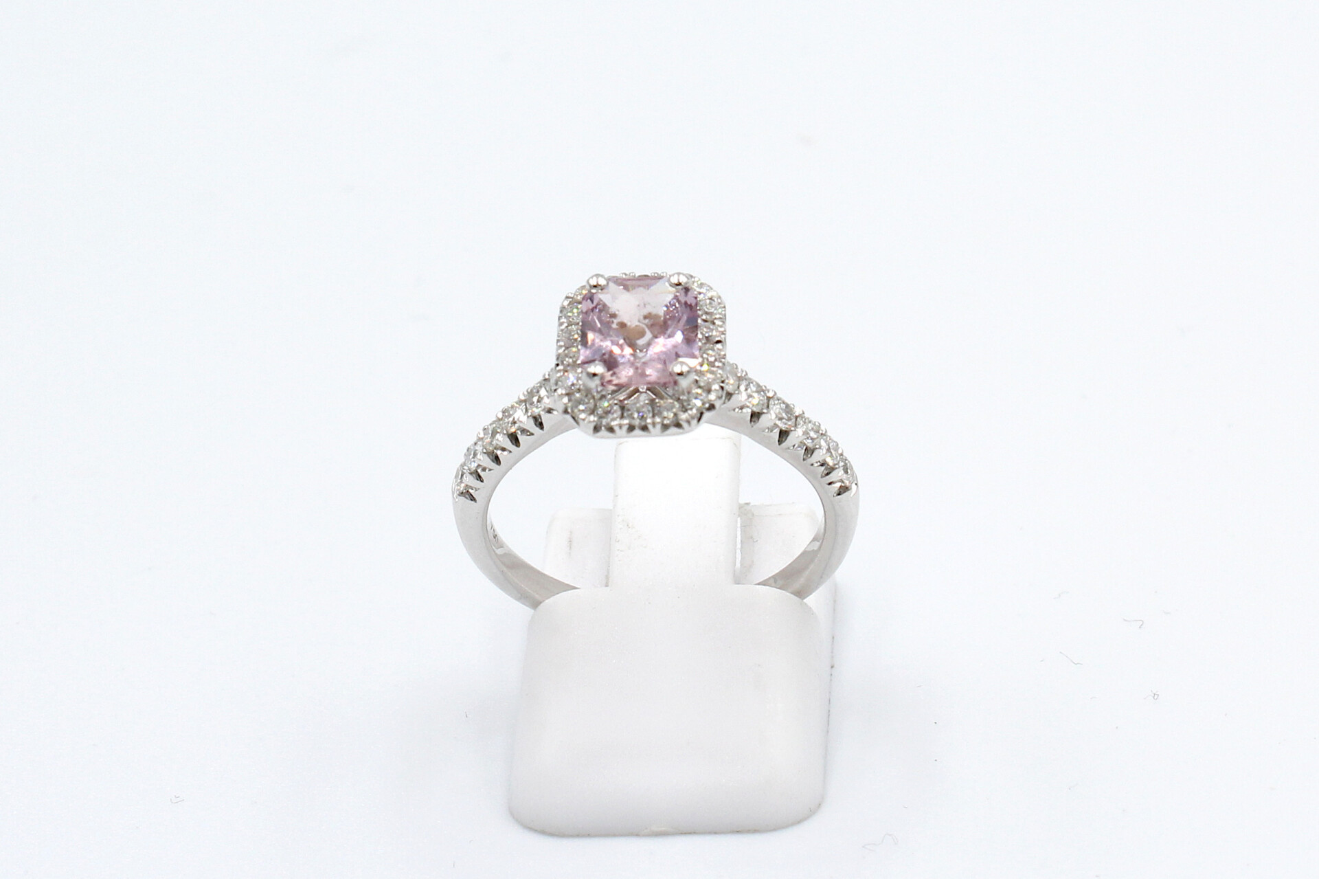 front view of a pink sapphire halo ring