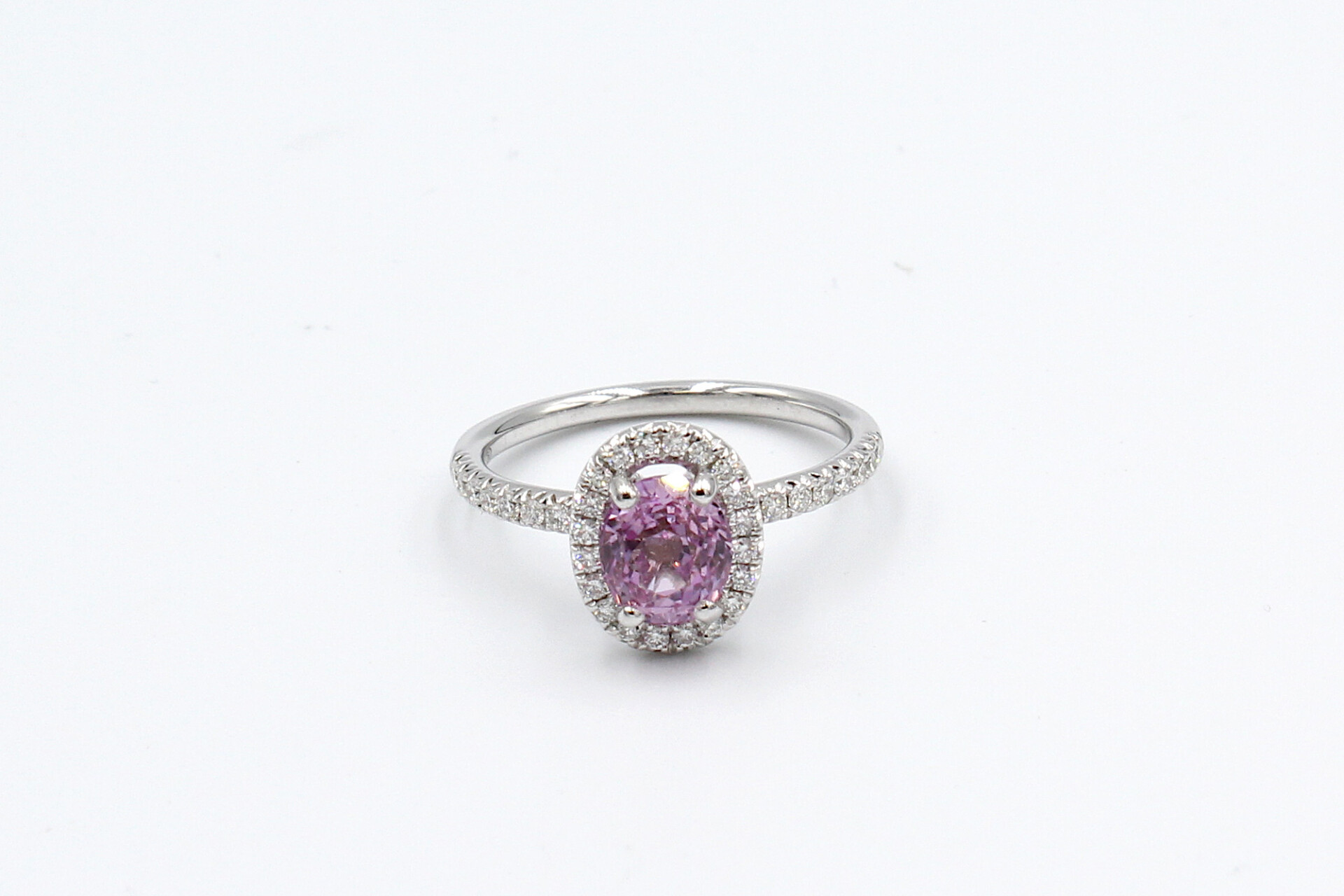 top view of a pink sapphire halo ring