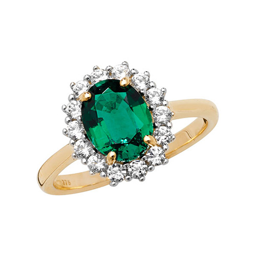 yellow gold ring with emerald and white sapphire oval
