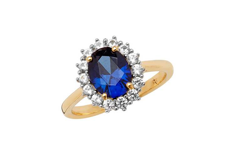yellow gold ring with blue sapphire and white sapphire oval