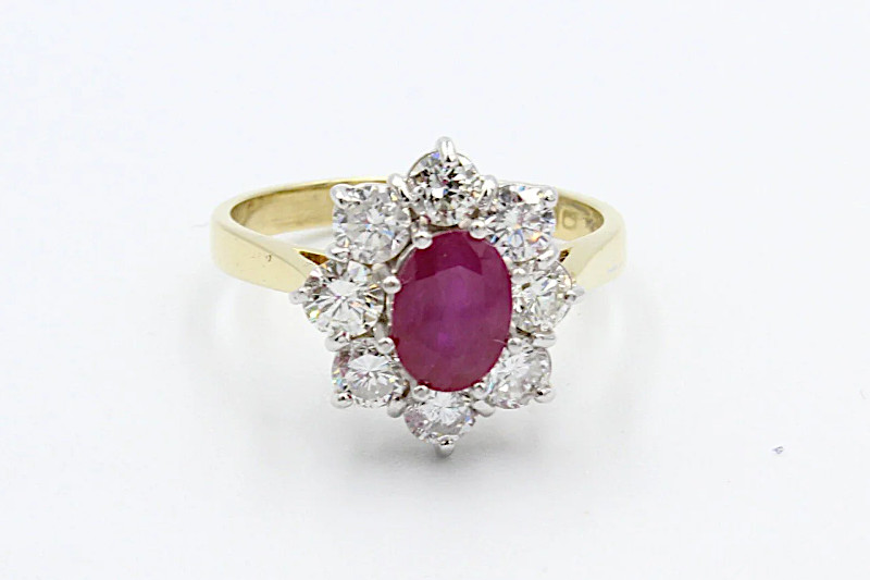 ruby and diamond engagement ring on a white background