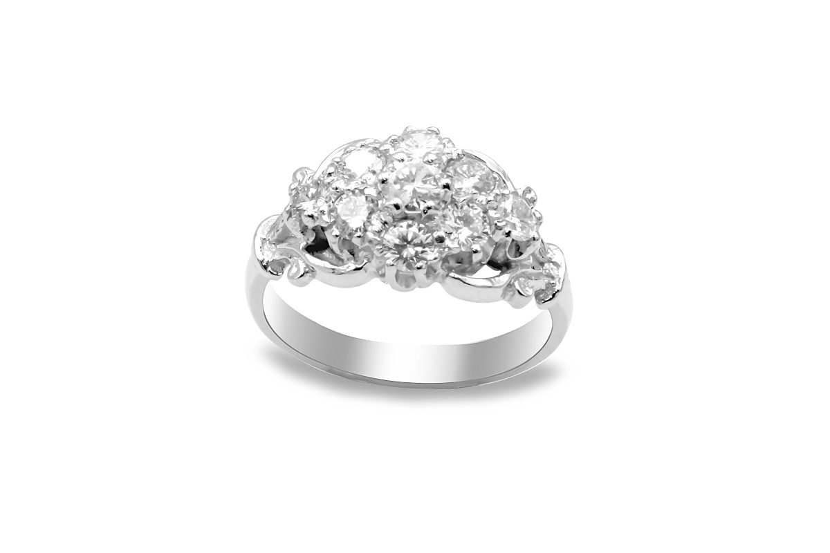 white gold engagement ring set with a cluster of diamonds