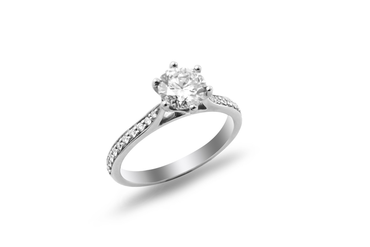 solitaire diamond ring with diamond set shoulders and made from platinum
