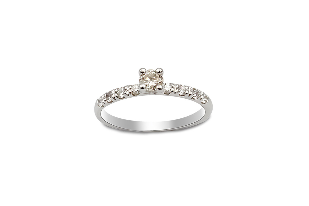 platinum ring with solitaire diamond and diamond set shoulders