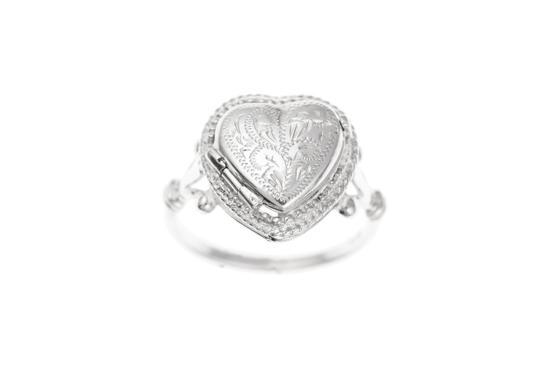 an engraved silver ring locket