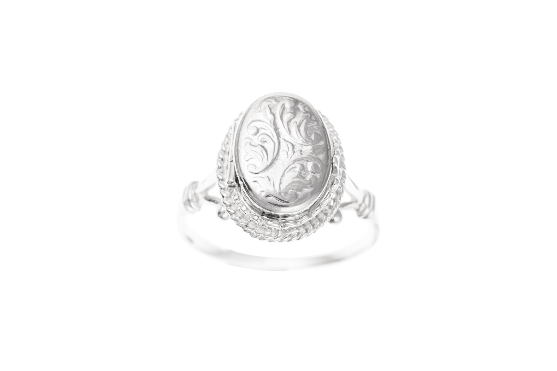 an engraved silver ring locket