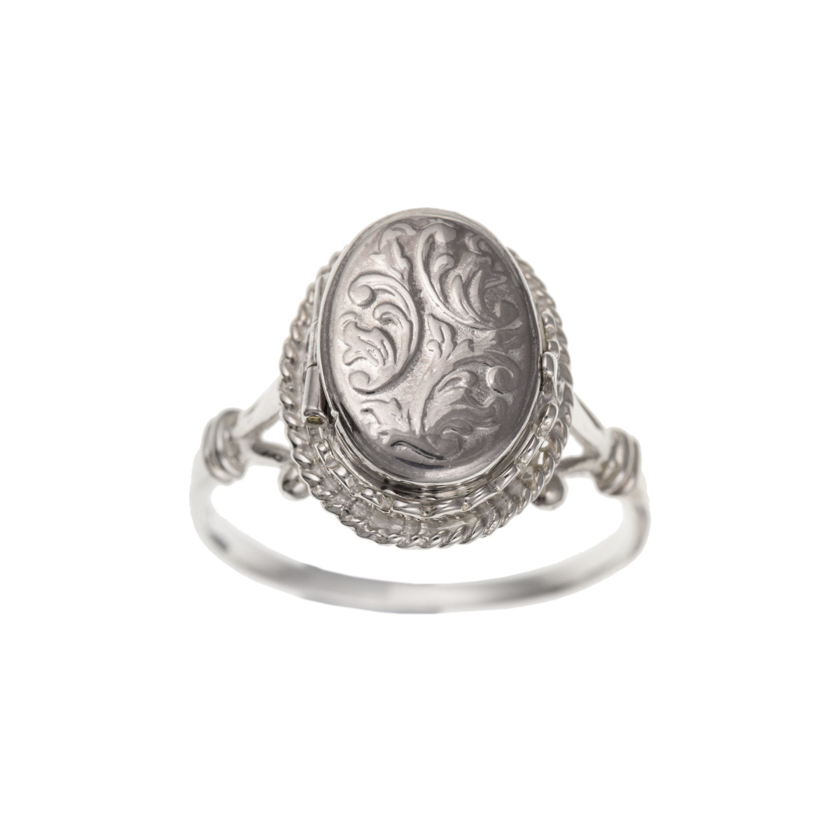 an engraved silver ring locket