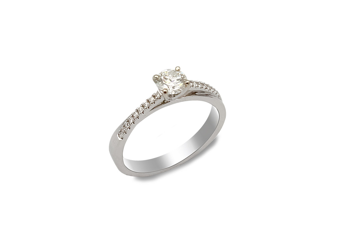 solitaire diamond ring with diamond set shoulders, made from white gold