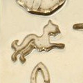 a gold celtic hound symbol
