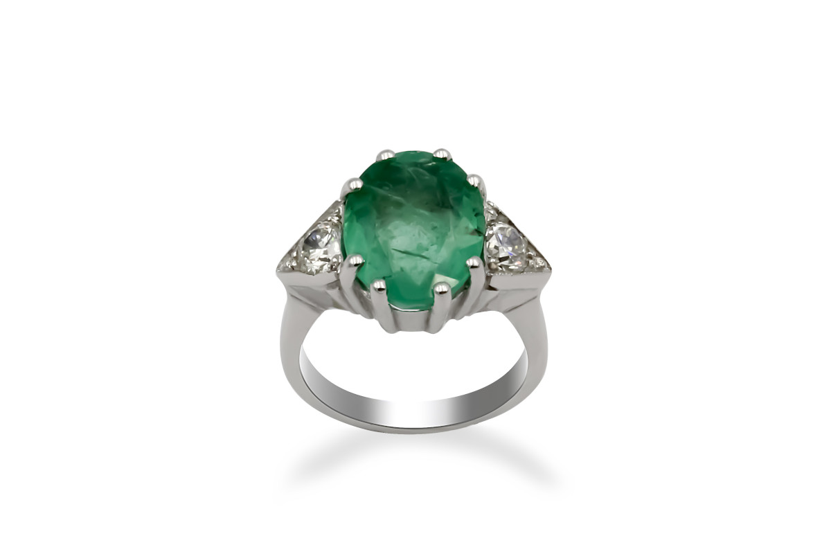 white gold diamond ring with large emerald gemstone