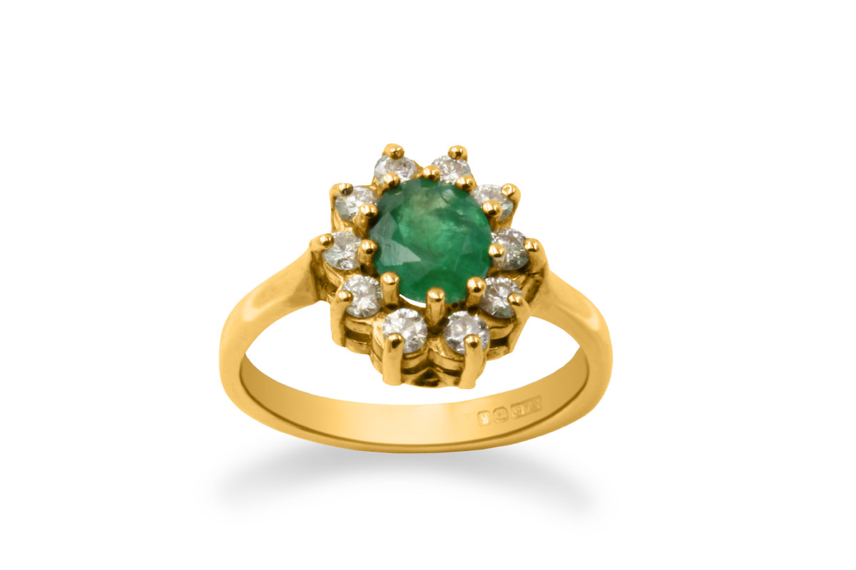 diamond and emerald cluster ring made from yellow gold