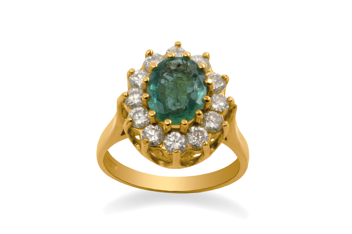 gold emerald and diamond cluster ring with large oval cut emerald gemstone