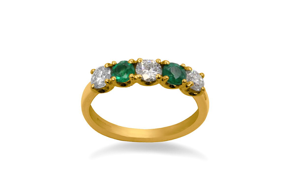 emerald and diamond engagement ring in yellow gold