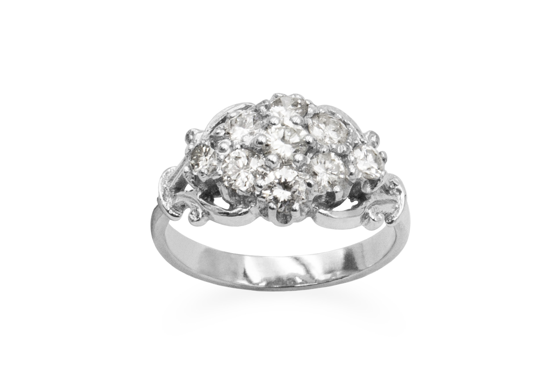 white gold engagement ring set with a cluster of diamonds